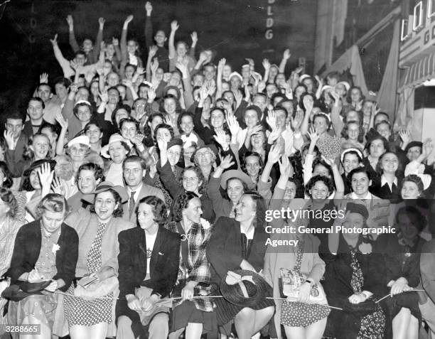 Some of the cinema audience at the premiere of ' When Tomorrow Comes,' directed by John M Stahl and starring Charles Boyer and Irene Dunne.