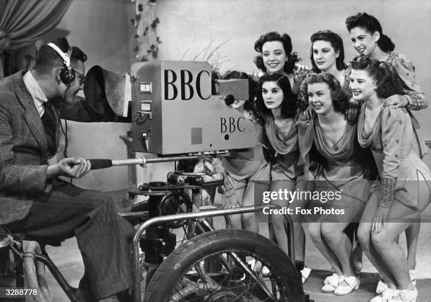 Group of 'Windmill Girls', dressed for the occasion, being televised at BBC's Alexandra Palace studios.