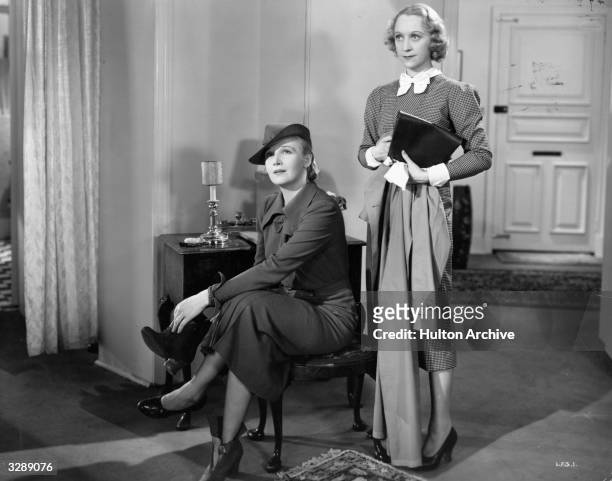 Ann Harding , the American leading lady and Binnie Hale , the British revue comedienne, in a scene from 'Love From A Stranger' , directed by Rowland...