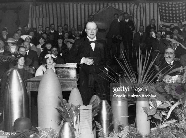 Winston Churchill speaking at a munitions factory in Ponders End.