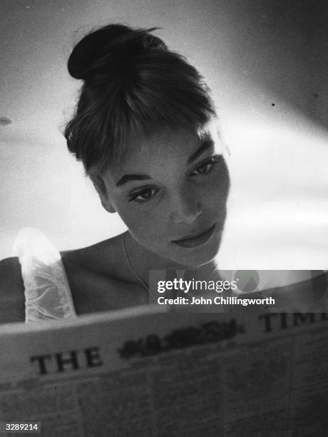 Italian actress and model Elsa Martinelli reading 'The Times' during a visit to London. Original Publication: Picture Post - 8666 - Elsa Decided...