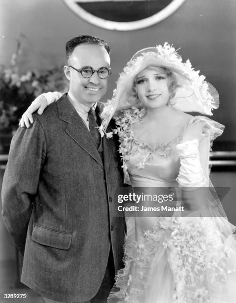 Lovely actress Anita Page gets a visit from her father, Papa Marino during the filming of 'Our Modern Maidens', directed by Jack Conway for MGM.