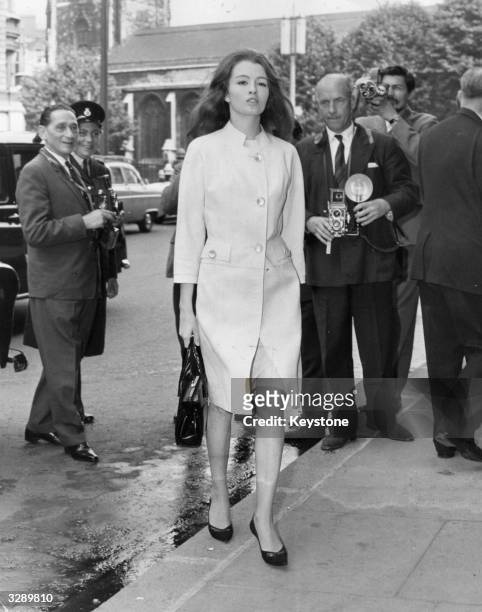 Christine Keeler, key witness in the vice case against society osteopath Stephen War, on her way to the Old Bailey with photographers ready to catch...