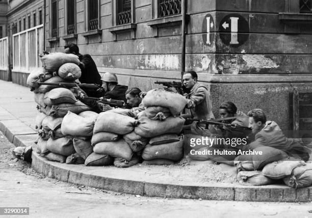 Italian Partisans in action during the liberation of Milan.