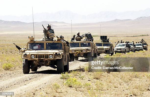 Special Forces and Afghan National Army convoy rolls through the countryside on the way to conduct joint village searches with the Afghan National...