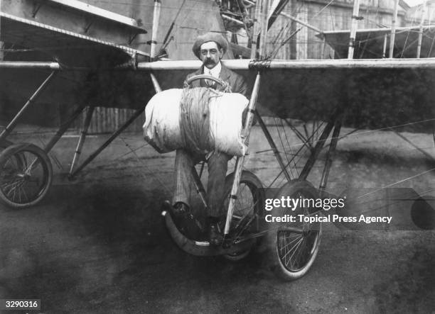 Mr William Newell with his parachute with which he made the first descent in England over Hendon from a five seater Grahame-White Charabanc.