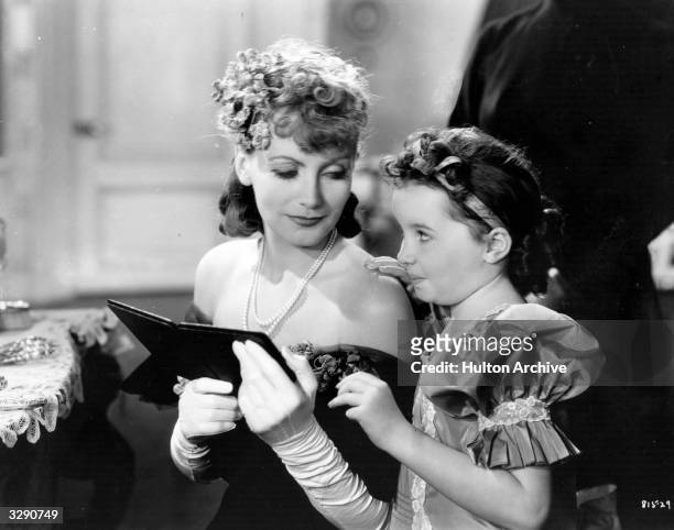 Scene from 'Anna Karenina', featuring Swedish actress Greta Garbo and child actress Cora Sue Collins as one of Dolly Oblonsky's children. The film...