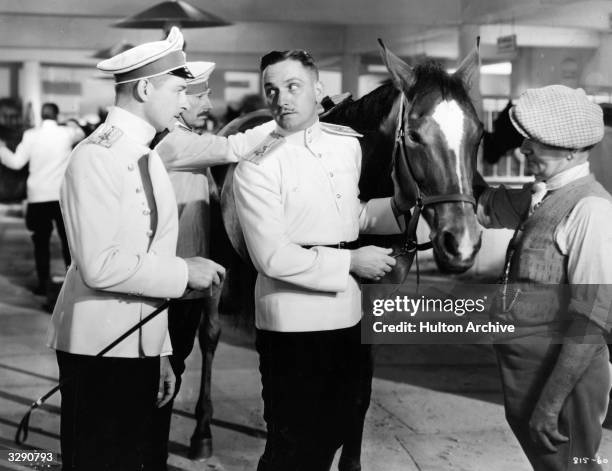 Scene from 'Anna Karenina', featuring Reginald Denny and Fredric March . The film was directed by Clarence Brown for MGM.