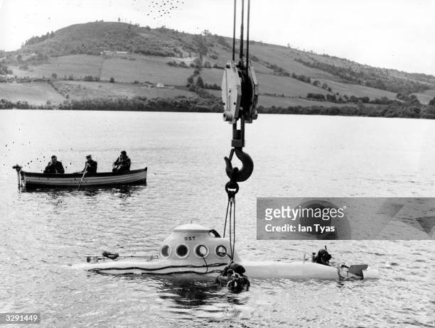 Submarine is lowered into Loch Ness to begin its search for the monster. References to a monster in Loch Ness date back to St Columba's biography of...