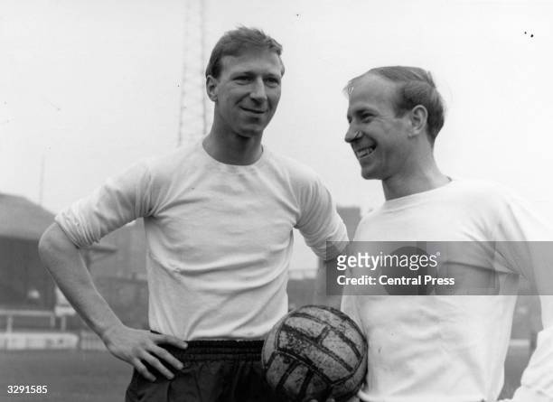 British footballers Jack Charlton and his brother Bobby Charlton. They are both members of the England team. Bobby plays for Manchester United, Jack...