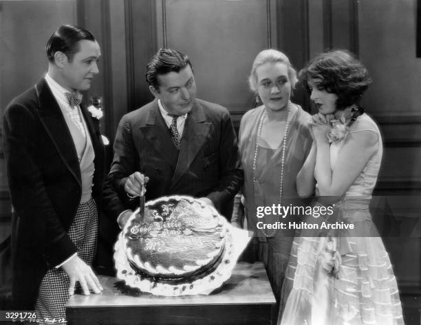 Director Lewis Milestone gets together with Louise Dresser, Charles Ray and Corinne Griffith, the stars of his film 'Garden Of Eden', to cut his...