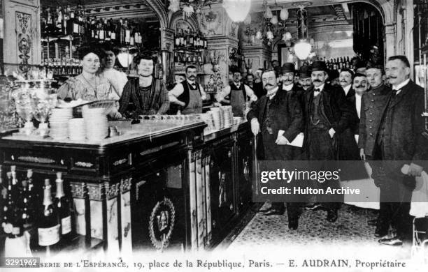 Staff and customers of the Brasserie de L'Esperance, in the Place de la Republique in Paris.