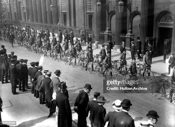 Automobile Association bicycle scouts in procession on their way to Liverpool Street Station, en route to camp.