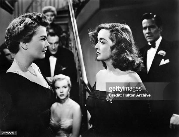 Anne Baxter and Bette Davis play Eve Harrington and Margo Channing in a scene from Joseph L Mankiewicz's 'All About Eve' . Marilyn Monroe can be seen...