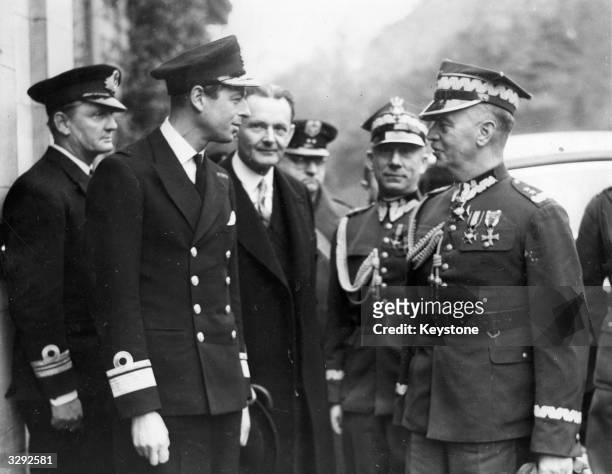 His Royal Highness George Edward Alexander Edmund , the Duke of Kent, with the Polish prime minister General Wladyslaw Sikorski, who is presenting...
