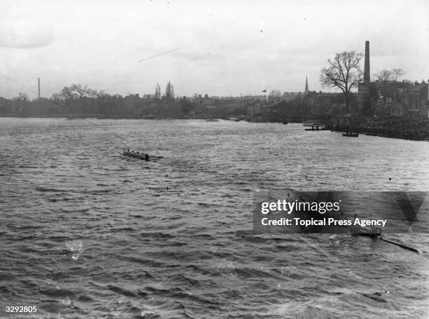 Oxford and Cambridge crews at speed during the' Varsity Boatrace.