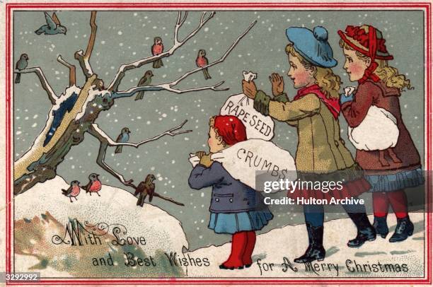 Children feeding the birds in this Victorian Christmas greetings card.