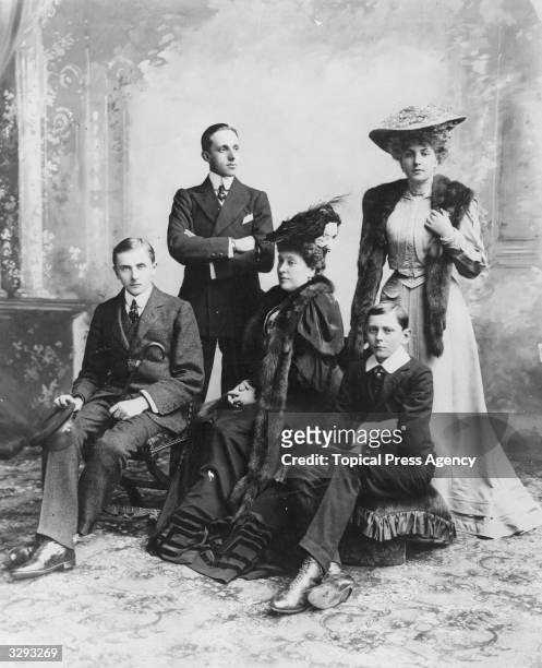 Princess Beatrice, , , with her family. Her daughter Princess Victoria Eugenie, , , is on the right; her fiance King Alfonso of Spain, , is at the...