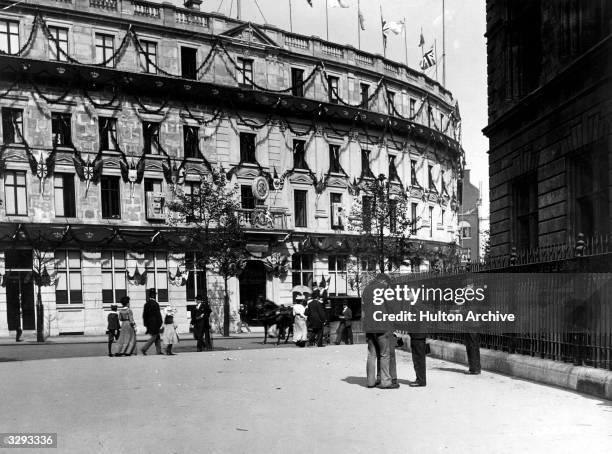 The end of Charing Cross Road, near the National Portrait Gallery, with decorations for the coronation of Edward VII. London Stereoscopic &...