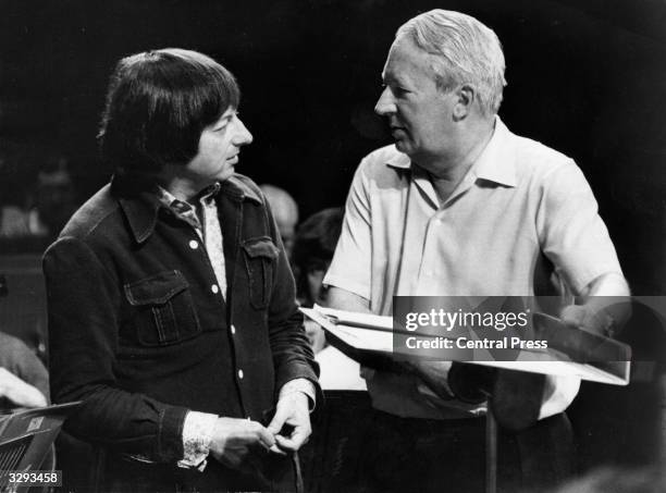 Edward Heath, the Conservative Party leader, with Andre Previn the principal conductor of the London Symphony Orchestra. Mr Heath conducted the...