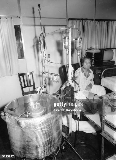 Patient is plugged in to an artificial kidney at the Royal Free Hospital in London.