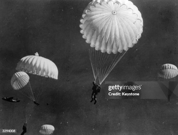 Paramarine Corps paratroopers, who later took part in landings in the Pacific, Burma and Sicily, practice their jumping from a US Marine Douglas...