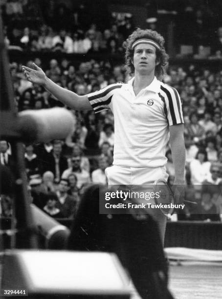 American tennis player John McEnroe disputes the umpire's call during a match at the Wimbledon Lawn Tennis Championships.