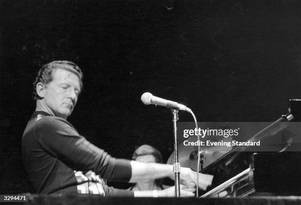 Piano pounding American rock 'n' roll singer 'the Killer' Jerry Lee Lewis, engrossed during a live performance.