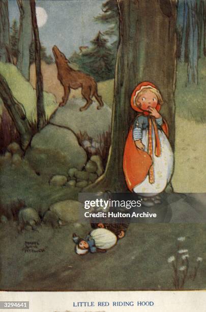 Little Red Riding Hood hides from the wolf in the forest in this postcard taken from the fairy tale by the brothers Grimm. Raphael Tuck & Sons -...