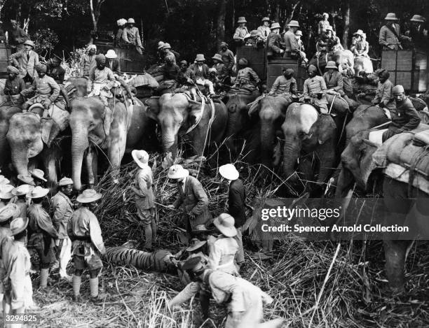 The Duke of Windsor, , as Edward, Prince of Wales, , at the 'kill' after a tiger hunt, during a royal tour of India. As Prince of Wales he travalled...