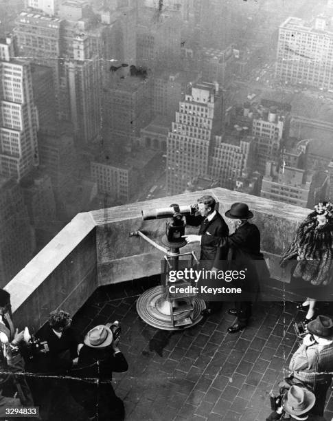 The Duke of Windsor, , on the rooftop of the Empire State building in New York, with American Democratic politician Al Smith, , a former Governor of...