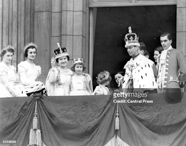 King George VI , and Queen Elizabeth on the balcony of Buckingham Palace after their Coronation ceremony with the Royal Princesses, Elizabeth and...