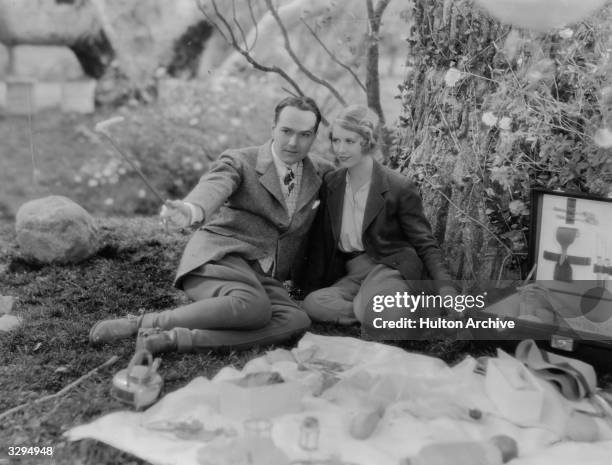 William Haines and Irene Purcell enjoy a quiet picnic in a scene from the film 'Just A Gigolo', based on the play 'Dancing Partner' by Alexander...