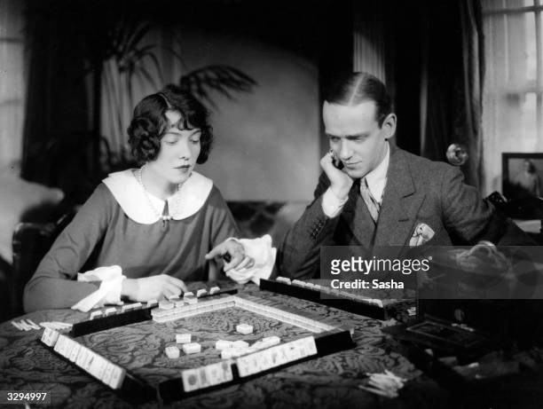 Fred Astaire and his sister Adele playing Mah Jong.