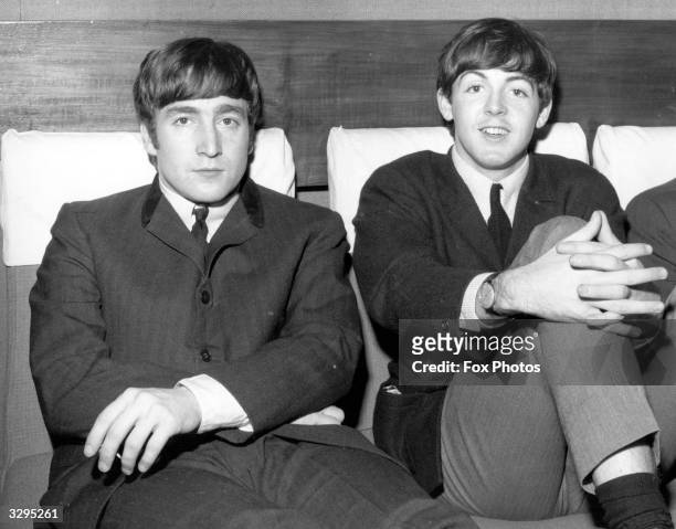 Two members of Liverpudlian pop group The Beatles, John Lennon , singer and guitarist, left, and Paul McCartney, singer and bass guitarist.