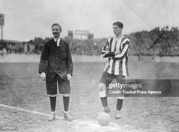 William "Bill" McCracken, captain of Newcastle United FC, , with referee C R Hall at Plumstead, south London; the opponents are Woolwich Arsenal FC.