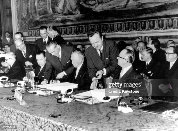 The German delegation sign the 'Treaty Of Rome'; the Common Market and Euratom treaties in Rome. The German delegation includes State Secretary for...