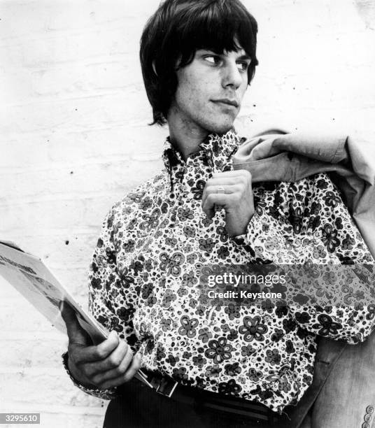 Jeff Beck, lead guitarist with British rhythm and blues group The Yardbirds, models a flowered shirt by John Stephen.