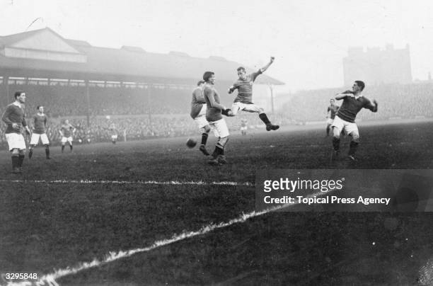 During a match between Chelsea FC and Bradford City FC at Chelsea's ground at Stamford Bridge, London, a Bradford forward leaps through the Chelsea...