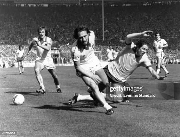 Arsenal 's Liam Brady tangles with West Ham United's Frank Lampard during the FA Cup Final match at Wembley. West Ham went on to win the final 1-0.