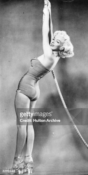 An early publicity shot of Marilyn Monroe .