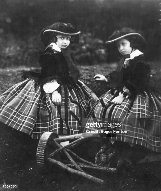 The princesses Helena and Louise, two of the children of Queen Victoria, in matching full dresses and bonnets. Princess Helena Augusta Victoria...