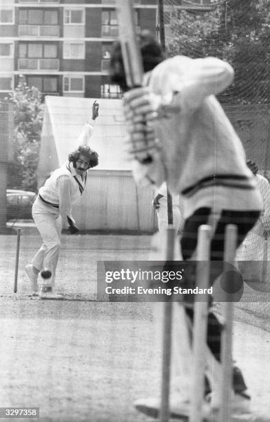 Asif Masood and some of the other members of the Pakistan team get in some practice at Lord's cricket ground, London.