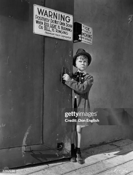 American child actor Jackie Cooper on a tour of inspection around the Paramount studio, where he is to appear in the film 'Skippy', directed by...