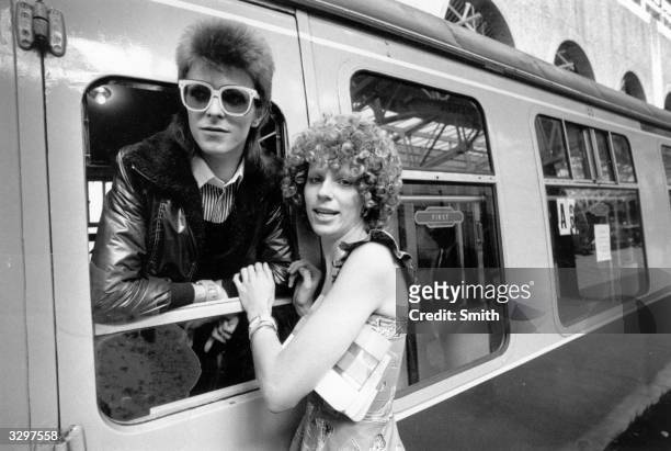Pop singer David Bowie is seen off at the station by his wife Angie.