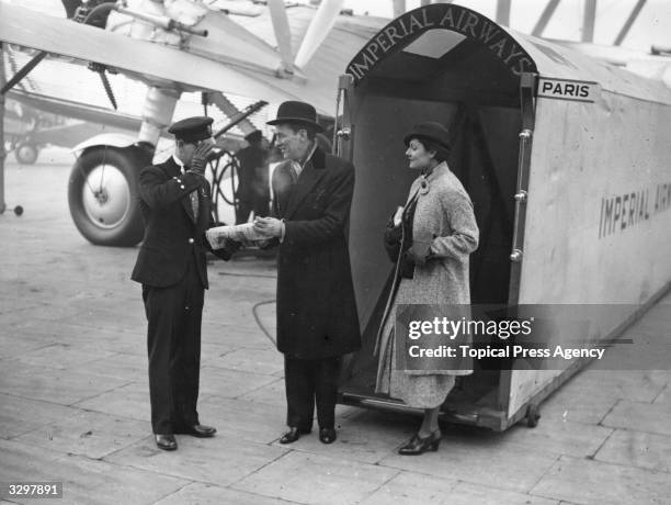 Record number of visitors to the Grand National at Aintree, Liverpool, travelled there by plane from Croydon airport. Jimmy Walker and his wife...