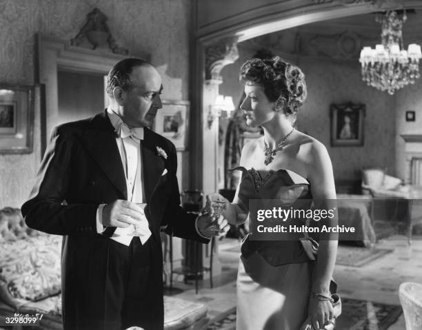 Cecil Parker , formerly Cecil Schwabe talking with Helen Cherry in a scene from the film 'His Excellency'. The film was directed by Robert Hamer for...