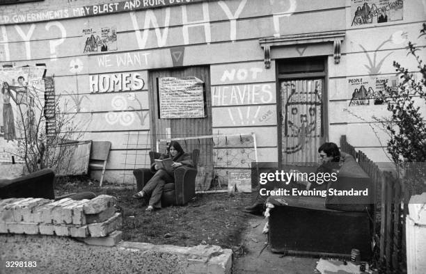 Squatters relax outdoors at Charteris Road, London N4.