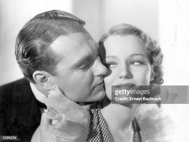 Cheek to cheek embrace between Ralph Bellamy , the soft voiced American actor, and Constance Cummings , the stage name of Constance Halverstadt, the...