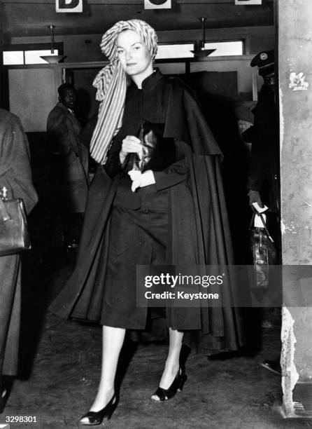 Doris Duke, the 'world's richest woman', arriving at La Guardia Airport, New York en route from Buenos Aires, where her husband, Porfirio Rubirosa,...